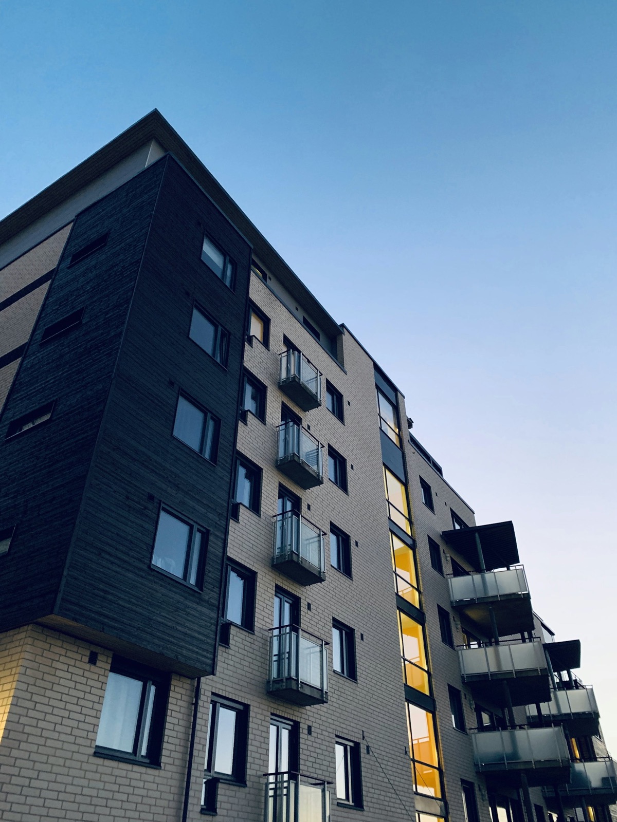 Contemporary apartment tower against blue sky
