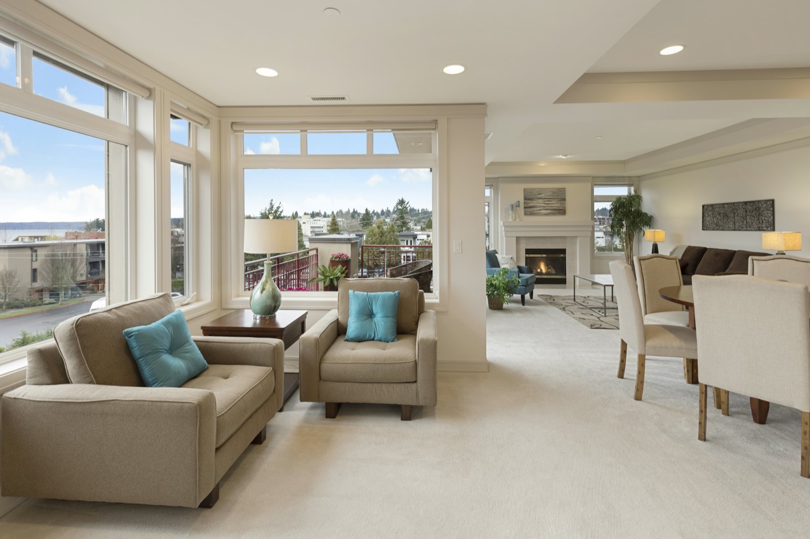 Sunroom with large windows and soft seating
