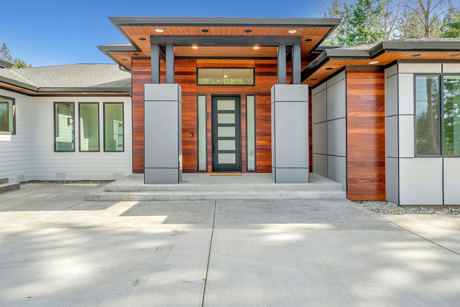 Single-level home with warm timber facade